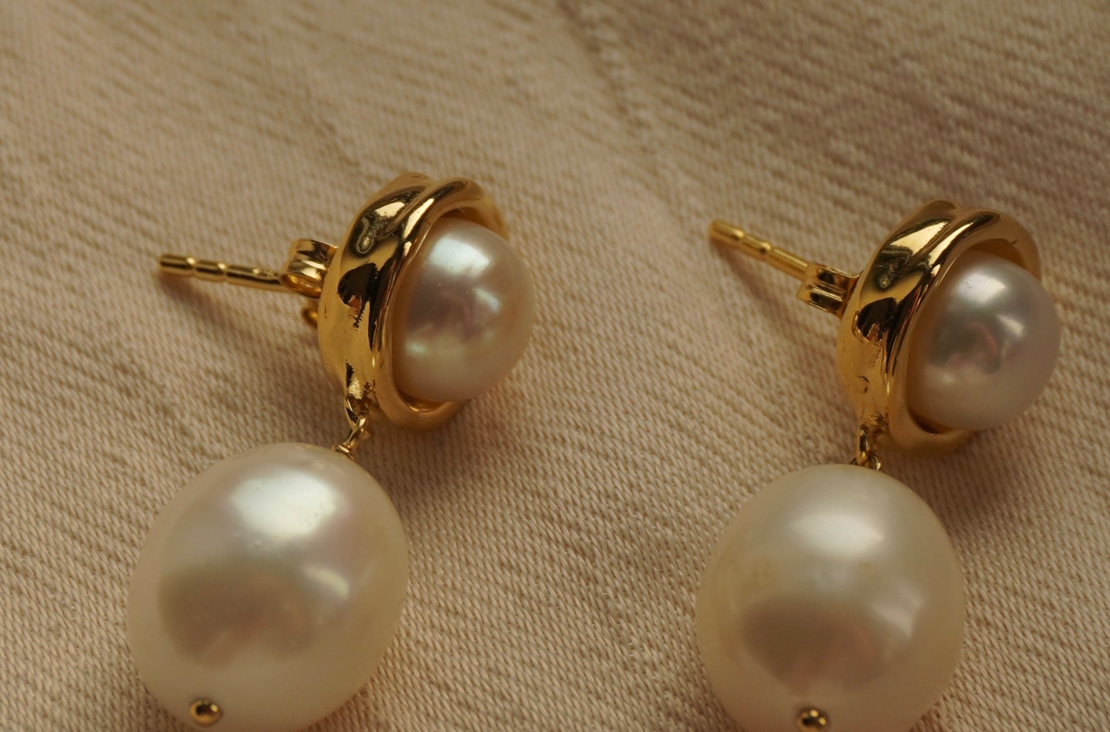 A pair of By Glaze recycled 18k gold hoop earrings with white double pearl drops perfect for bridal jewellery, bridesmaids or a chic statement pair 