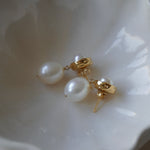 A pair of By Glaze recycled 18k gold hoop earrings with white double pearl drops perfect for bridal jewellery, bridesmaids or a chic statement pair 