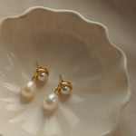 A pair of By Glaze recycled 18k gold hoop earrings with white double pearl drops perfect for bridal jewellery, bridesmaids or a chic statement pair 