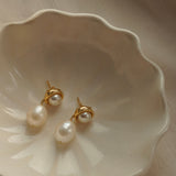 A pair of By Glaze recycled 18k gold hoop earrings with white double pearl drops perfect for bridal jewellery, bridesmaids or a chic statement pair 